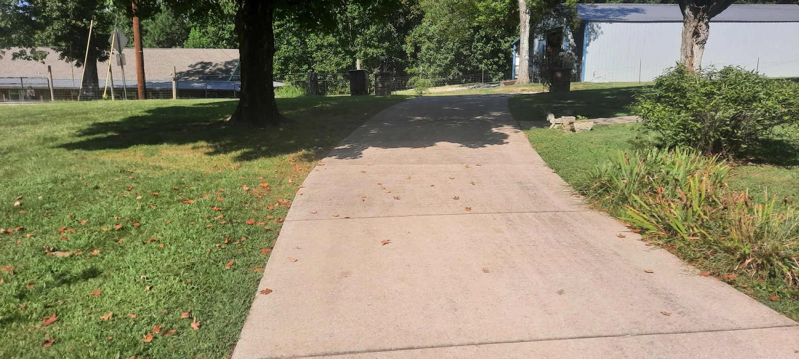 Before cleaning: Curved Driveway Cleaning — Wilson County, TN